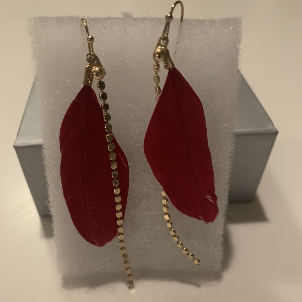 Red feather and gold earrings